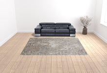 4' X 6' Tan Ivory And Blue Geometric Power Loom Distressed Area Rug