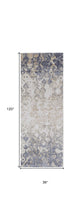 4' X 6' Tan Ivory And Blue Abstract Power Loom Distressed Area Rug