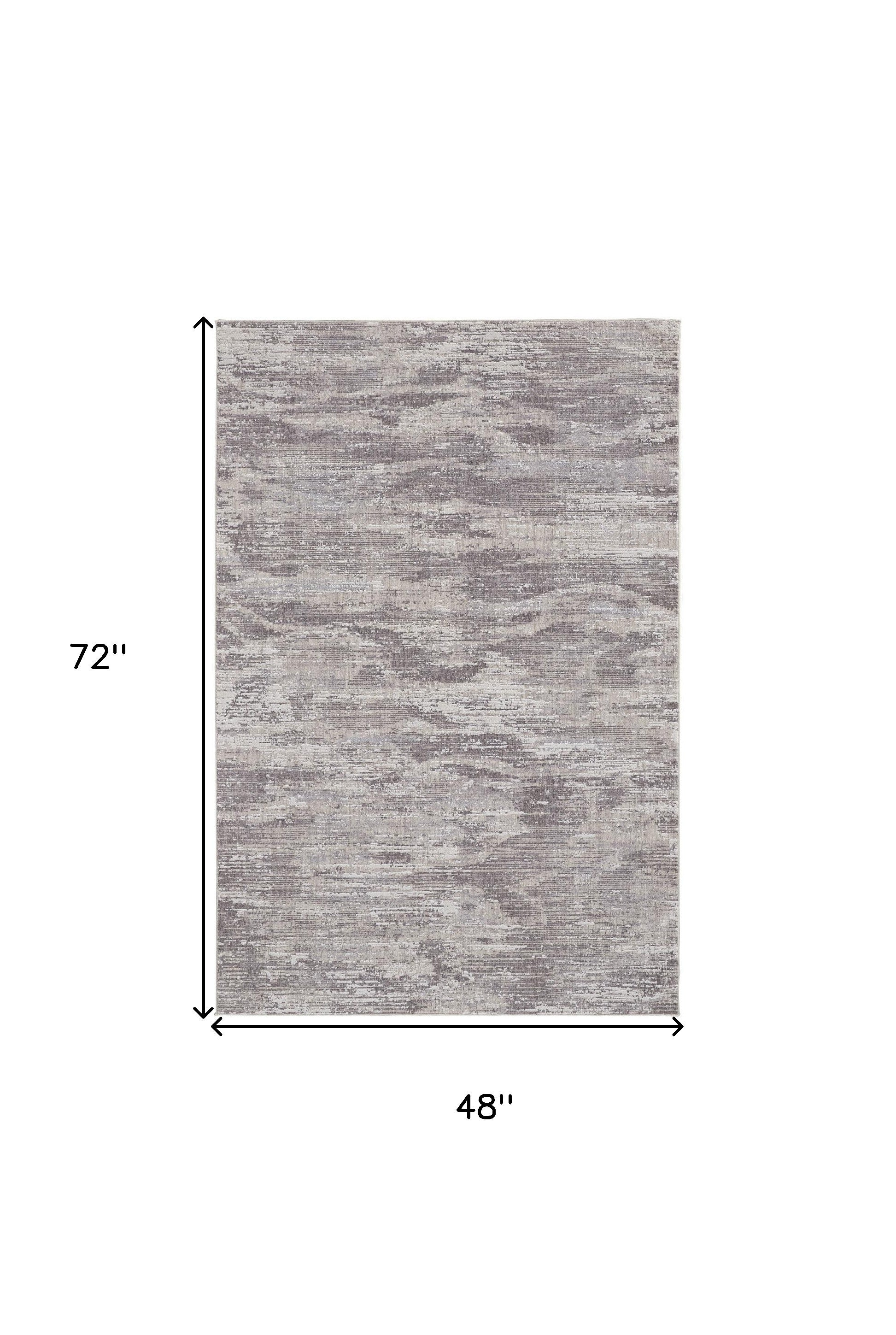 4' X 6' Tan Taupe And Gray Abstract Power Loom Distressed Stain Resistant Area Rug