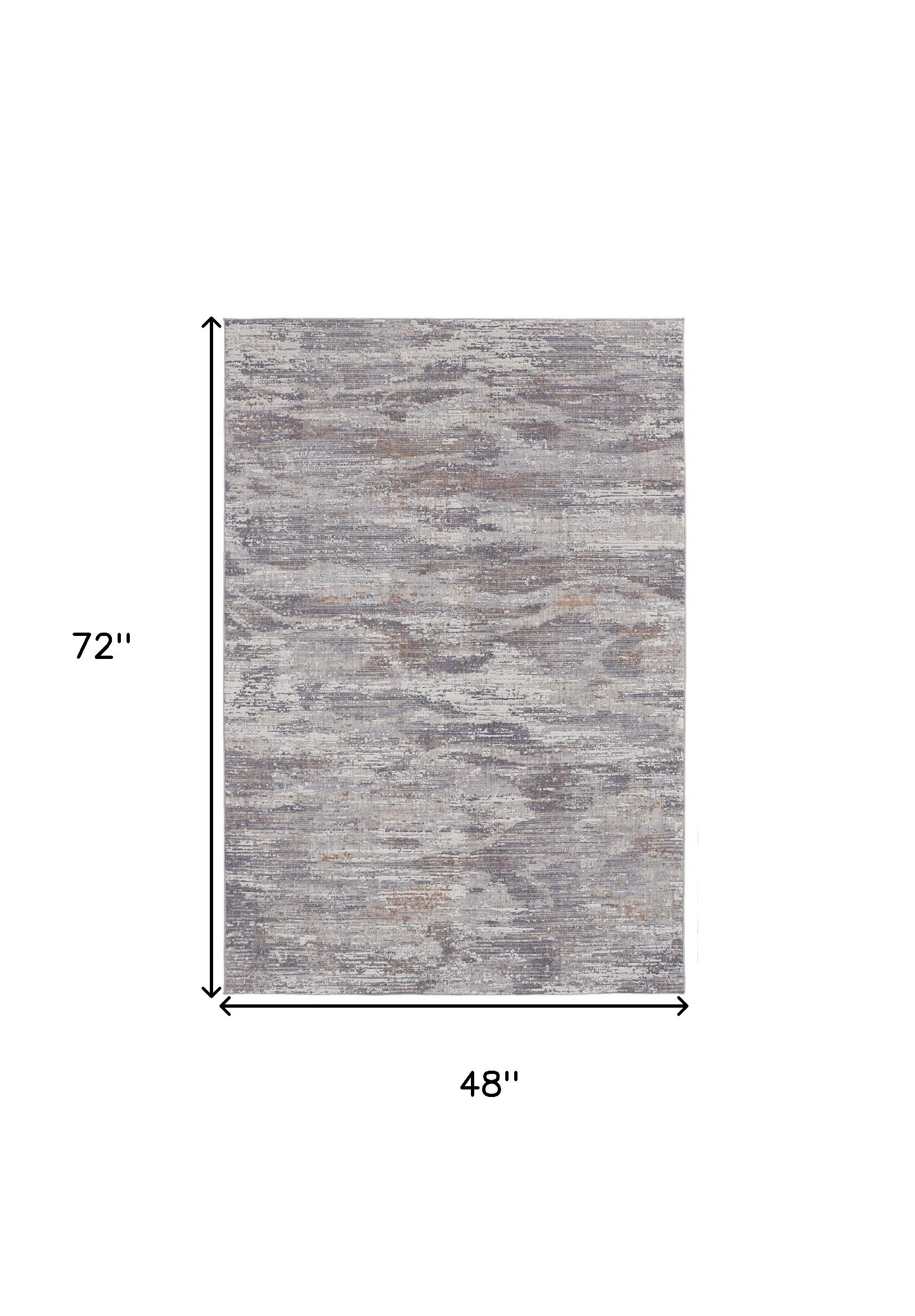4' X 6' Tan Taupe And Gray Abstract Power Loom Distressed Stain Resistant Area Rug