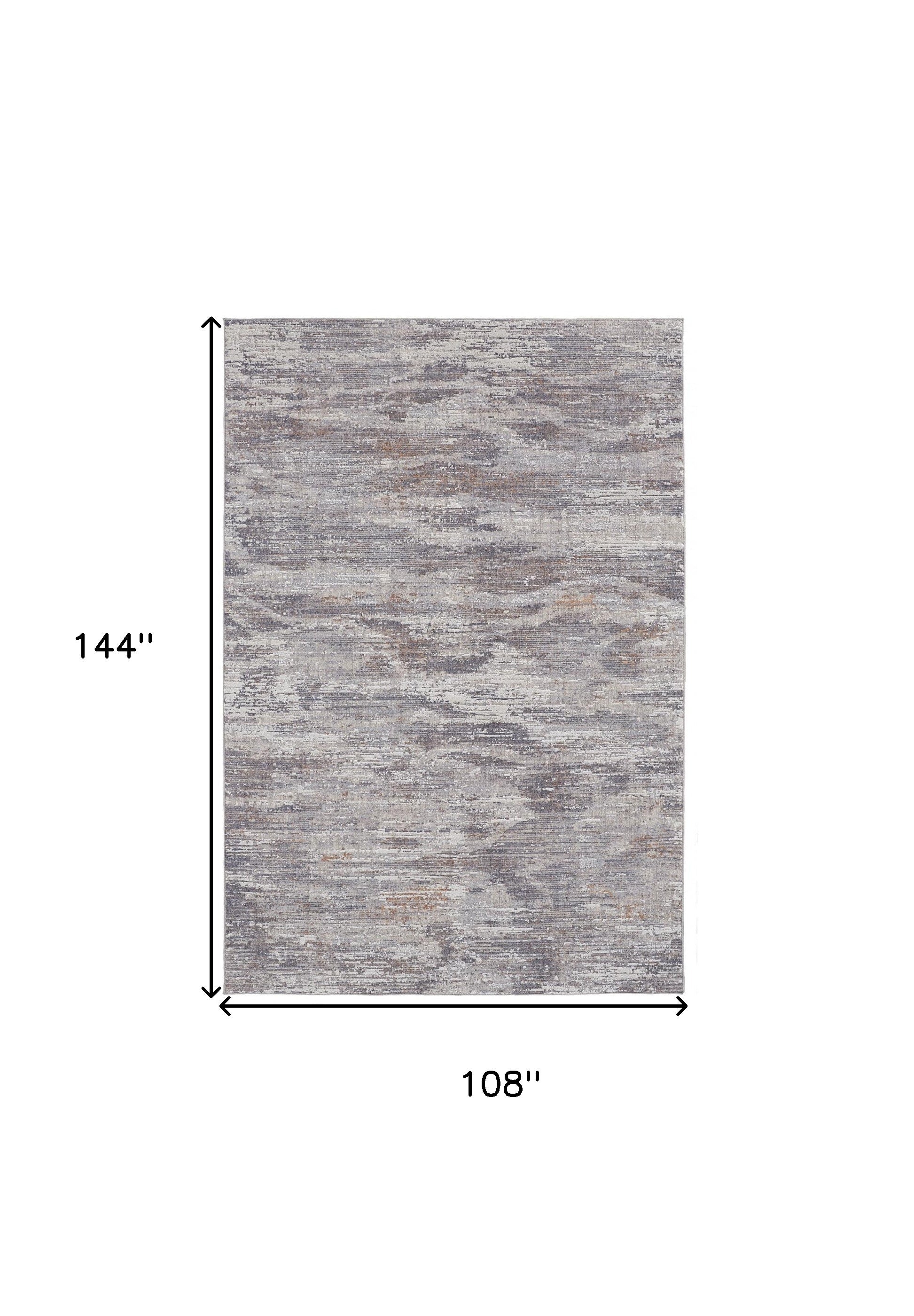 4' X 6' Tan Taupe And Gray Abstract Power Loom Distressed Stain Resistant Area Rug