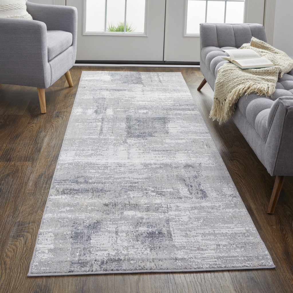 4' X 6' Taupe Tan And Blue Abstract Power Loom Distressed Stain Resistant Area Rug