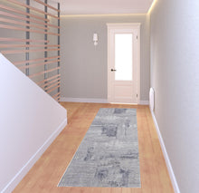 4' X 6' Taupe Tan And Blue Abstract Power Loom Distressed Stain Resistant Area Rug