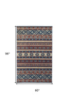 Blue Tan And Black Geometric Power Loom Distressed Stain Resistant Area Rug - 4' x 6'