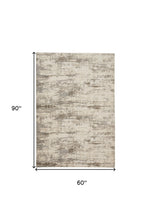 4' X 6' Ivory And Brown Abstract Area Rug