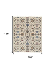 4' X 6' Ivory Blue And Tan Wool Floral Tufted Handmade Stain Resistant Area Rug