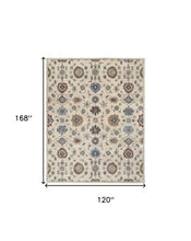 4' X 6' Ivory Blue And Tan Wool Floral Tufted Handmade Stain Resistant Area Rug