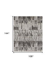 4' X 6' Ivory Brown And Gray Abstract Power Loom Stain Resistant Area Rug