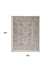 4' X 6' Ivory And Tan Floral Hand Knotted Stain Resistant Area Rug