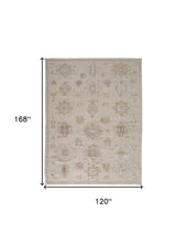 4' X 6' Tan And Brown Floral Hand Knotted Stain Resistant Area Rug