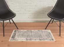2' X 3' Ivory Black And Taupe Abstract Stain Resistant Area Rug