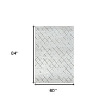 5' X 7' Cream Geometric Area Rug