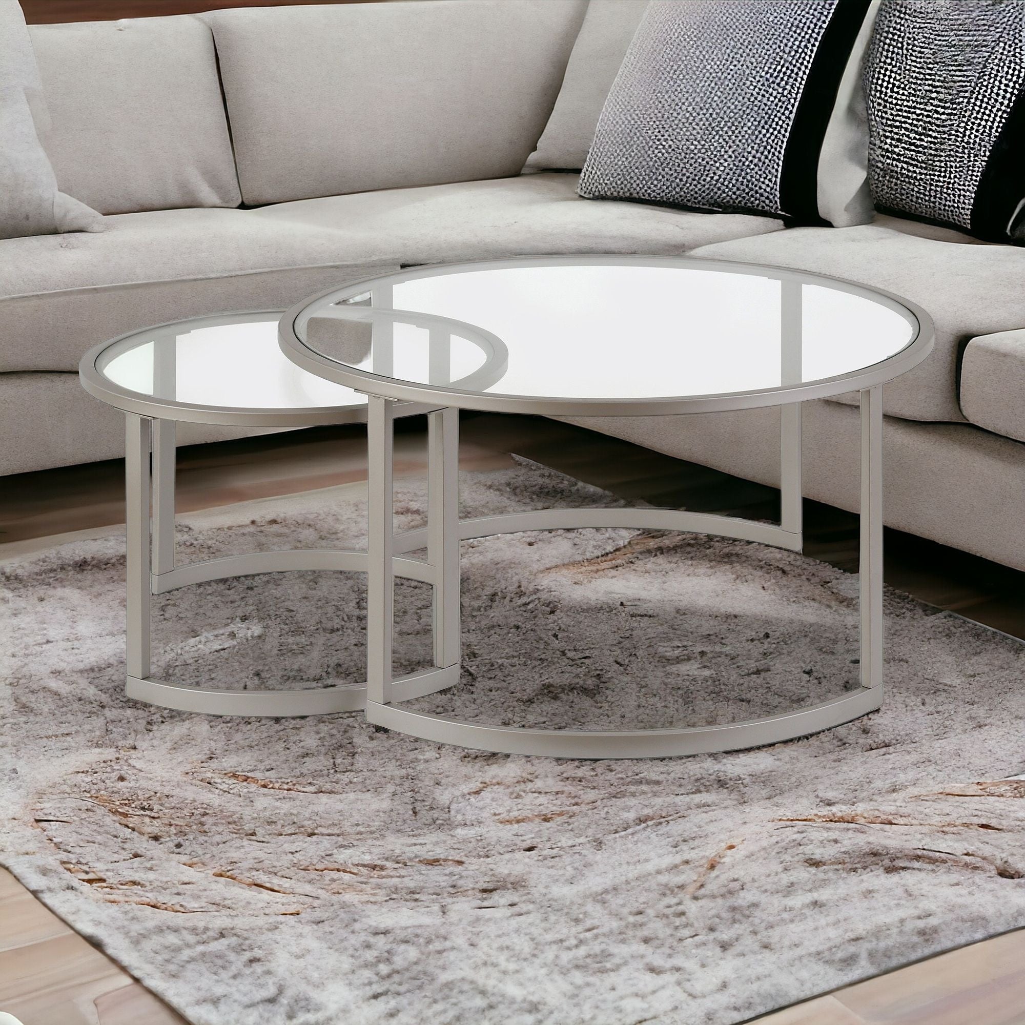 Set Of Two 36" Nickel and Glass Round Nested Coffee Tables